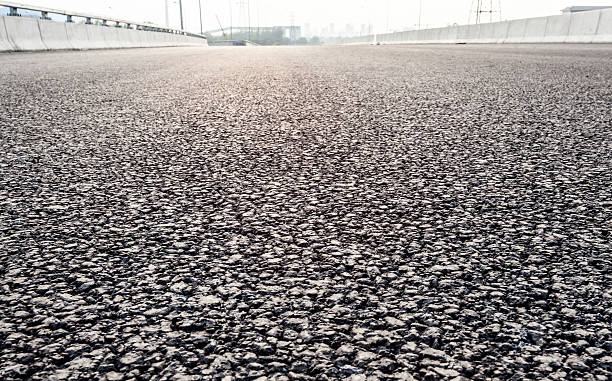 istock close-up new asphalt road 470851610