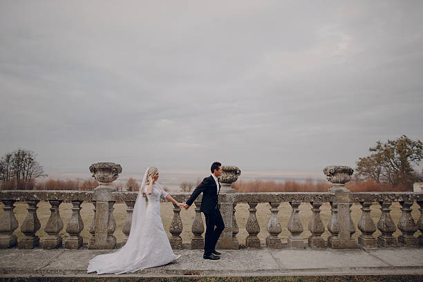 istock bride walking in golden autumn nature 470851836