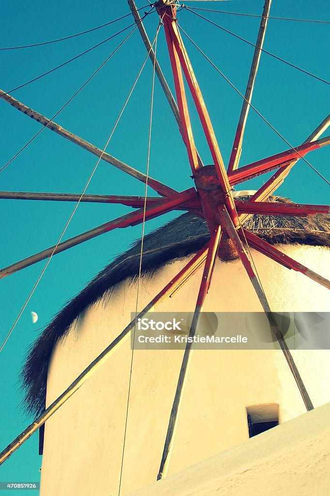 Windmill on Mykonos Island Historic Windmill on Mykonos Greek Island with deep blue sky and half-moon. 2015 Stock Photo