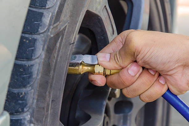 istock Filling air into a car tire 470851964