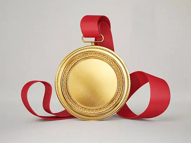 gold medal isolated on a grey background