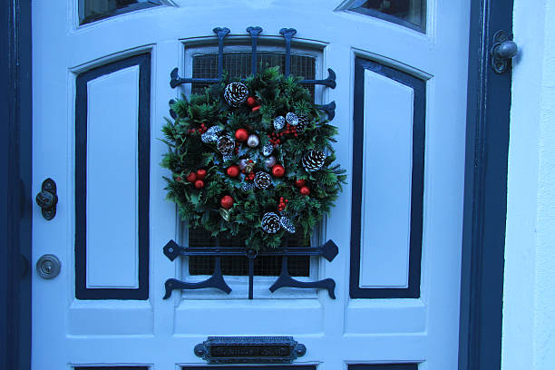 istock Classic christmas wreath with decorations on a door 470855892