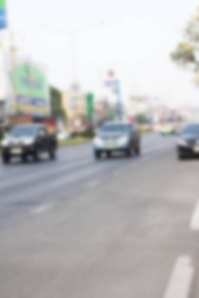 istock blurred of car on road 470857132