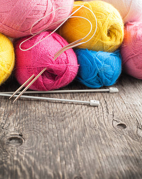 istock Yarn on wooden background. 470858409