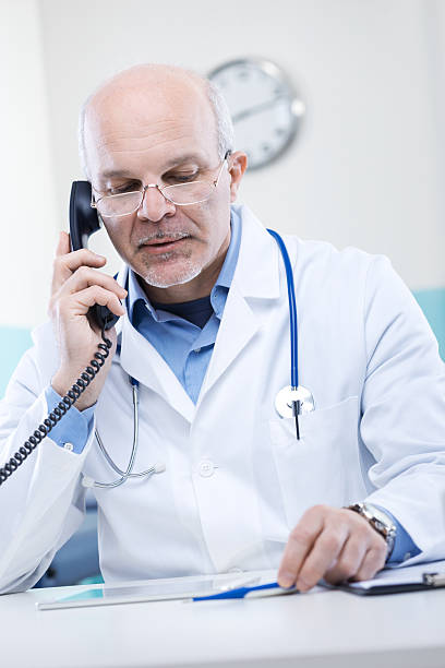 istock Doctor on the phone 470859723