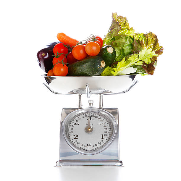istock Vegetables and fruits on a weighing scale 470859881