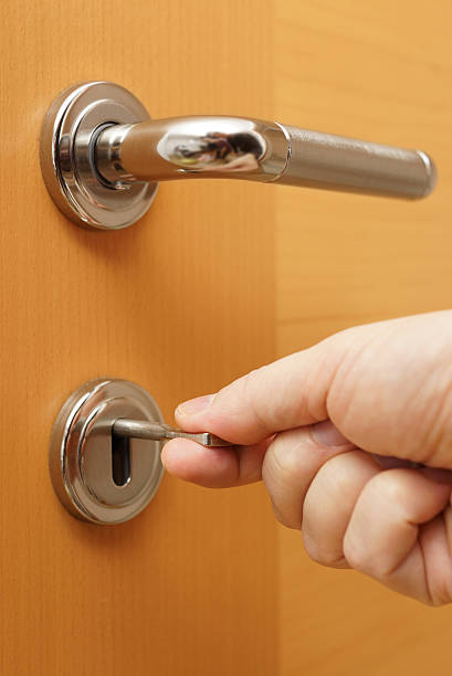 istock Locking up or unlocking door with key in hand 470860851