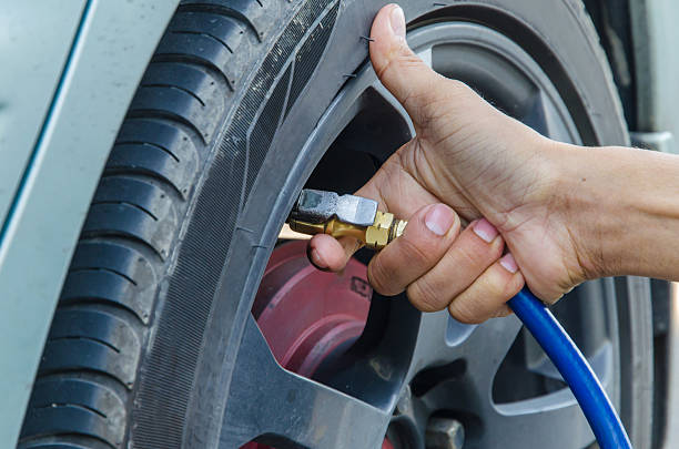 istock Filling air into a car tire 470861266
