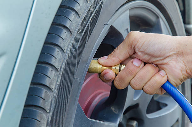 istock Filling air into a car tire 470861272
