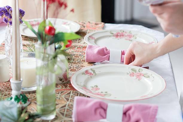 istock putting silveware on the table for thanksgiving holiday 470863512
