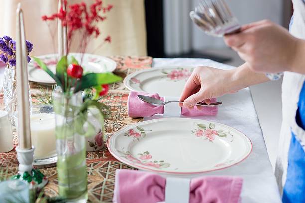 istock putting silveware on the table for thanksgiving holiday 470863514