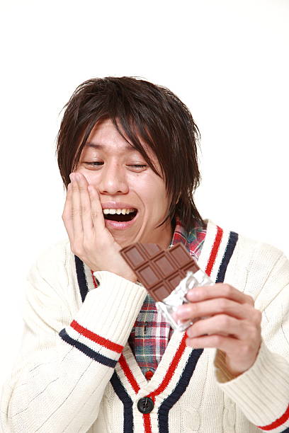 istock young Japanese man suffers from toothache 470866364