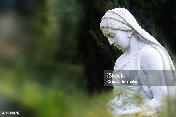 Woman Sculpture Of Marble In A Park Or Cemetery Stock Photo - Download Image Now - Statue, Virgin Mary, Cemetery