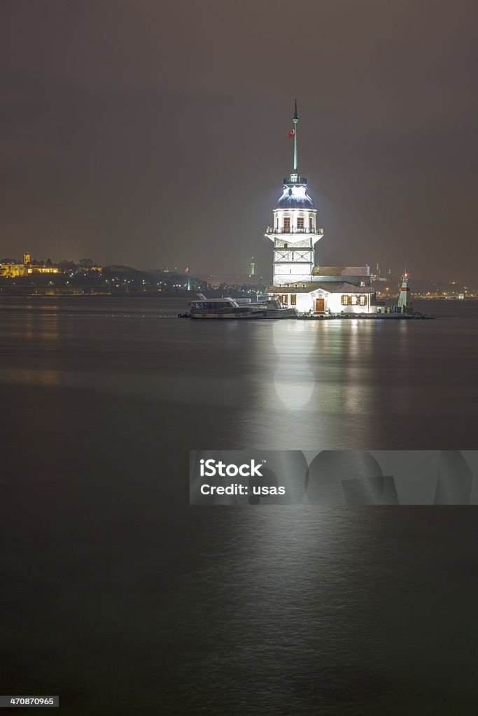 Maiden's Tower in Turkey -Long exposure The Maiden's Tower (Turkish: Kız Kulesi), also known in the ancient Greek and medieval Byzantine periods as Leander's Tower (Tower of Leandros), sits on a small islet located at the southern entrance of Bosphorus strait 200 m (220 yd) off the coast of Üsküdar in Istanbul, Turkey. Architecture Stock Photo