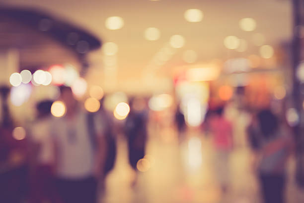 istock Blurred image of people in shopping mall with bokeh 470873678