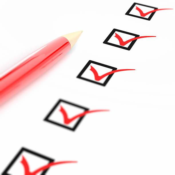 istock Marked checklist and red pen in white background 470874051