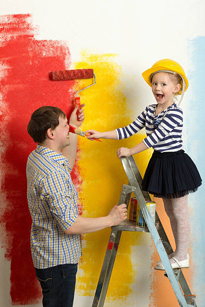 istock Family fun during wall painting 470874232