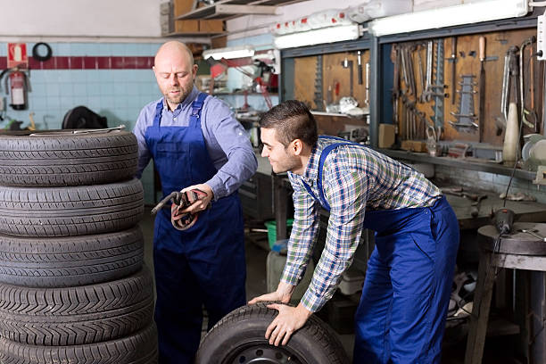 istock Mounting specialists in coveralls working 470877326