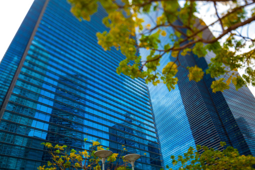 Singapore, Singapore - February 18, 2014: Reflection of Citibank, anchor tenant at Asia Square Tower 1 taken at the lawn at marina bay. The reflection is on marina Bay financial tower 1.