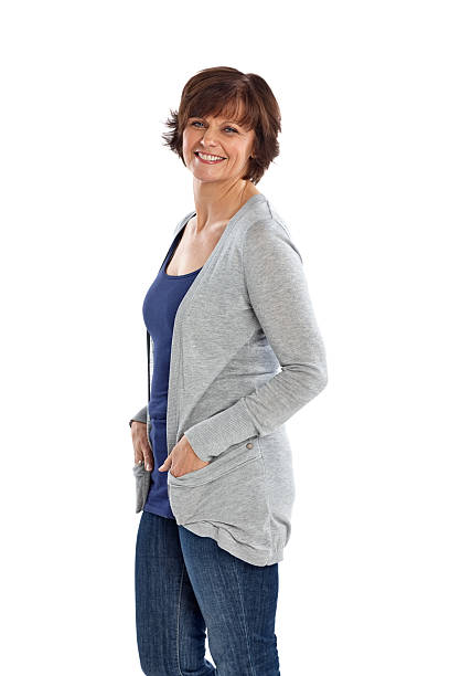 istock Pretty mature lady standing against white 470879914