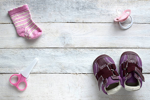 istock Some baby stuff on a white wooden table 470879952