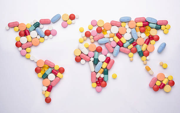 World map medicine Pills in world map shape world health organization photos stock pictures, royalty-free photos & images