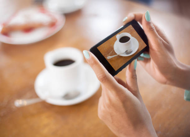 istock Woman talking picture of coffee 470886604