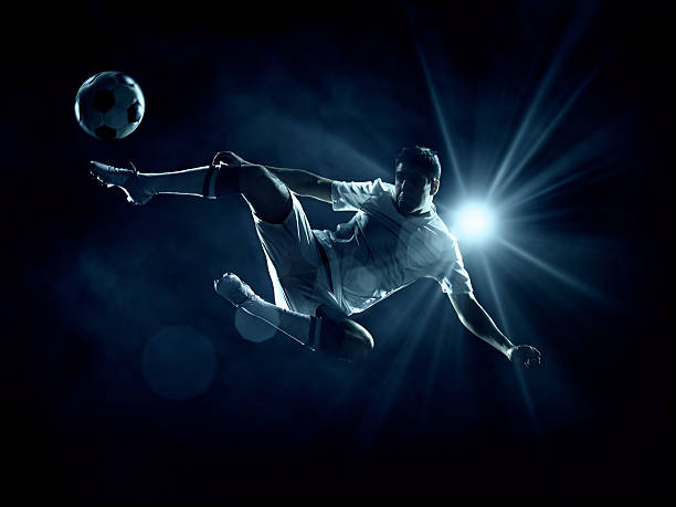 istock Soccer Player Kicking Ball 470887975