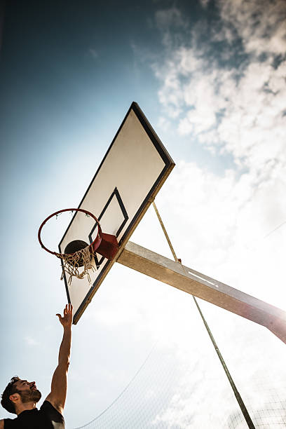 istock basketball player jumping to score 470891888