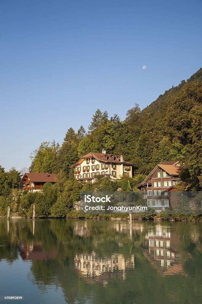 Lake and the house in Interlaken Beautiful view of the lake and the house in Interlaken, Switzerland At The Edge Of Stock Photo