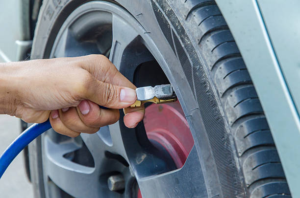 istock Filling air into a car tire 470894614