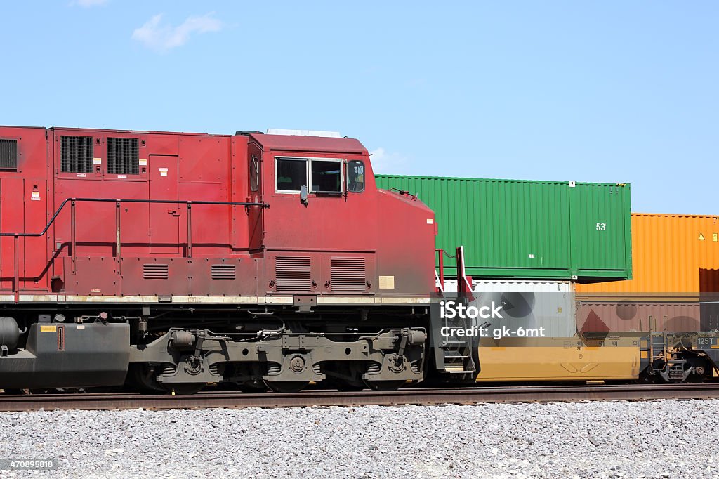 Freight train and cargo containers Freight train locomotive and cargo containers 2015 Stock Photo
