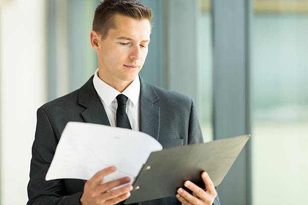istock businessman reading monthly report 470896814