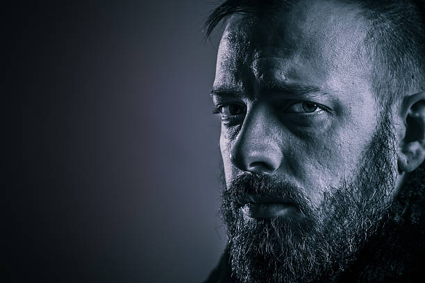 istock Young handsome bearded man in the coat 470898590