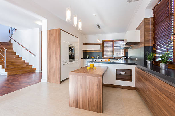 istock Spacious kitchen with white walls and wooden fittings  470898824
