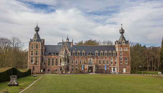Leuven, Belgium - March 07, 2015: Lawn and front view of Castle Arenberg, now being used as the main building of the university of Leuven