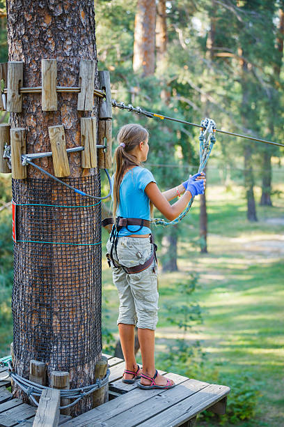 istock Girl in a climbing adventure park 470903690