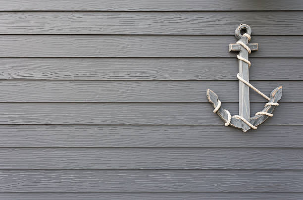 wooden anchor on wall background