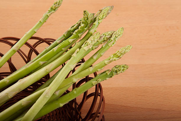 istock Fresh raw asparagus in basket 470909076