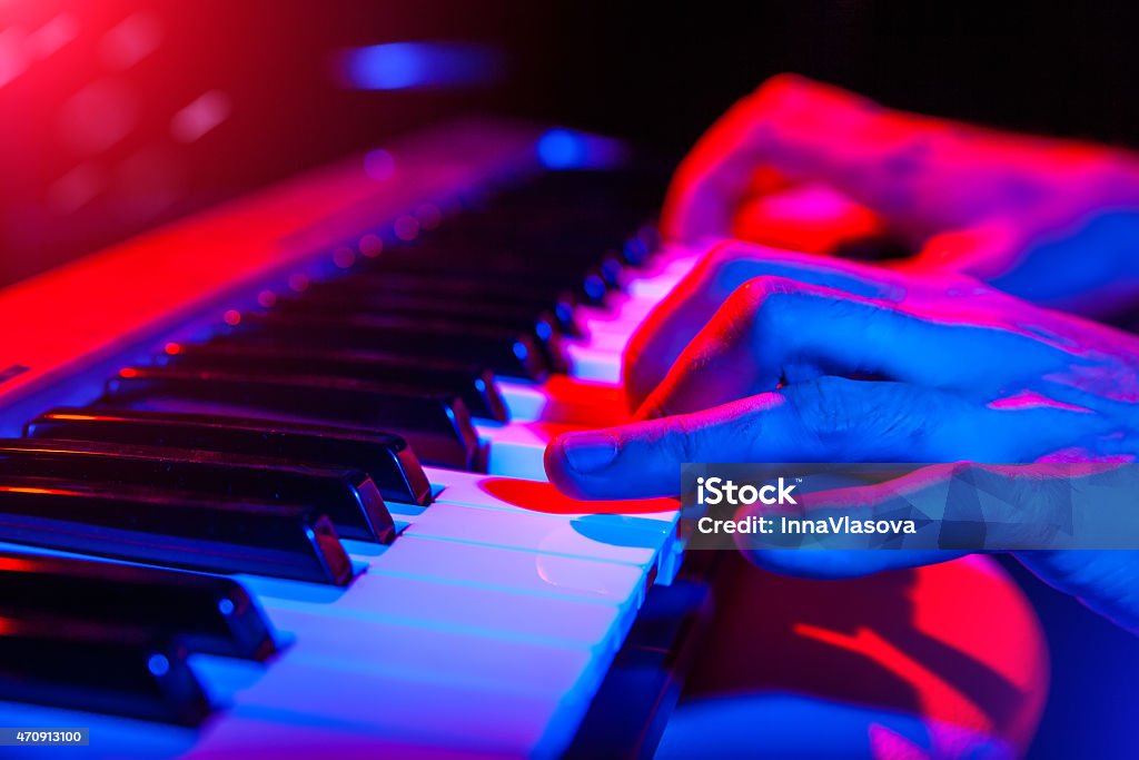 hands of musician playing keyboard in concert with shallow depth hands of musician playing keyboard in concert with shallow depth of field Piano Stock Photo