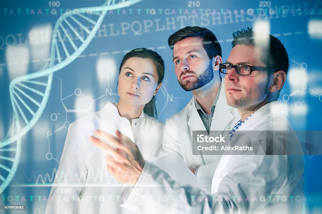 Genetic engineering Genetic engineering. Group of scientists working at the laboratory Teamwork Stock Photo