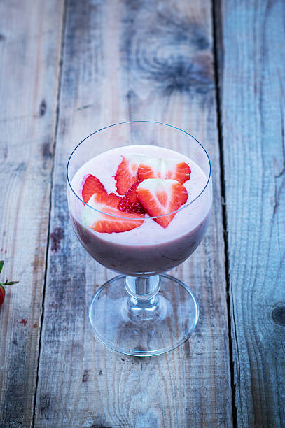 istock Strawberry smoothie on wooden table 470914924