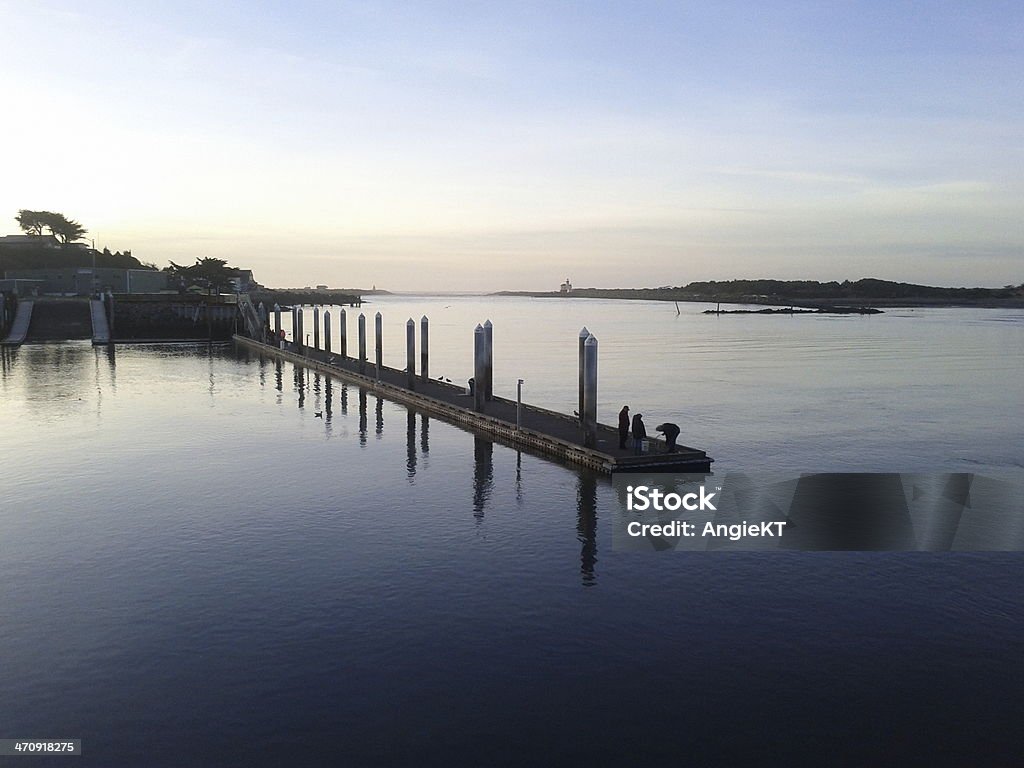 Pier at Bandon, Oregon Fishing on the Pier, Coquille River, Bandon, Oregon, on a clear evening Bandon Stock Photo