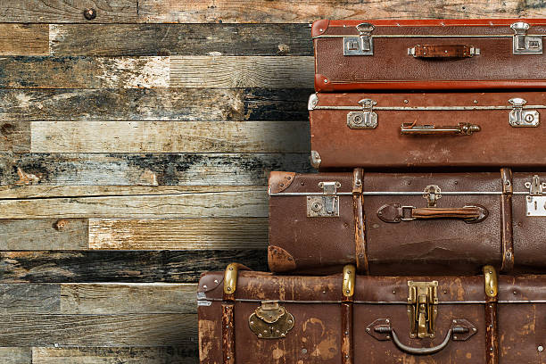 istock Old suitcases on wooden background 470918832