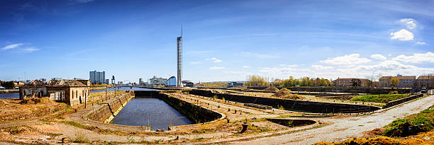 Panoramic View of the Govan Graving Docks, Glasgow A panoramic view of the three Govan Graving Docks and the ruins of the old pumping station, on the River Clyde at Govan in Glasgow. govan stock pictures, royalty-free photos & images