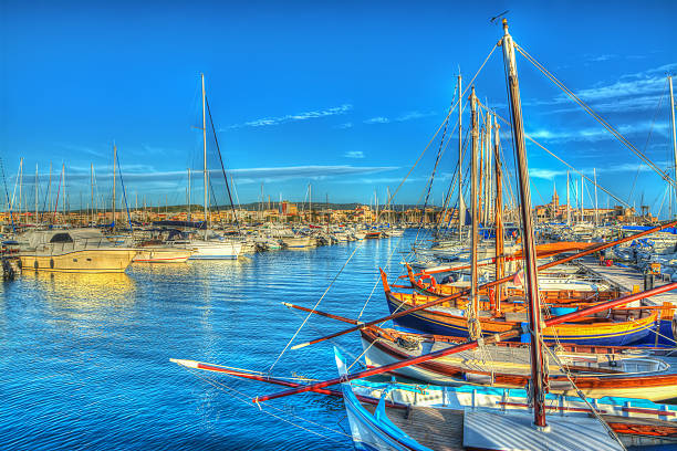 boats in Alghero harbor at sunset. Processed for hdr tone mapping effect