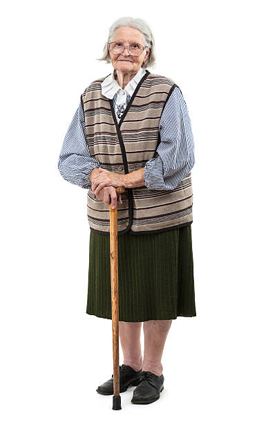 Old woman with a cane over white stock photo