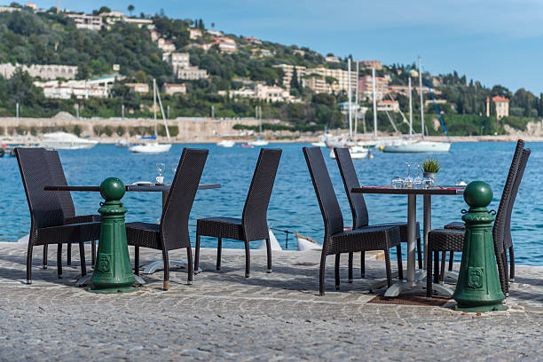 Restaurant tables positioned on the harbour edge