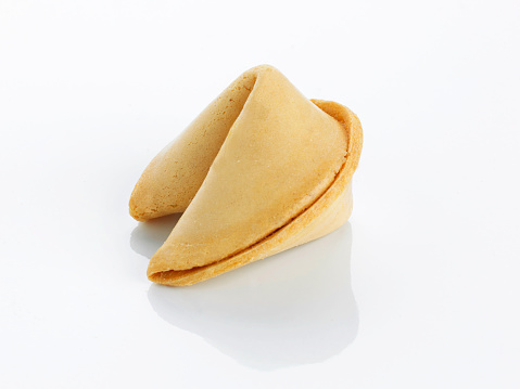 a single fortune cookie on a white background