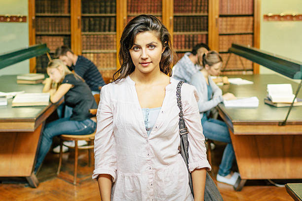 Young Student in Library - 20s students stock photo
